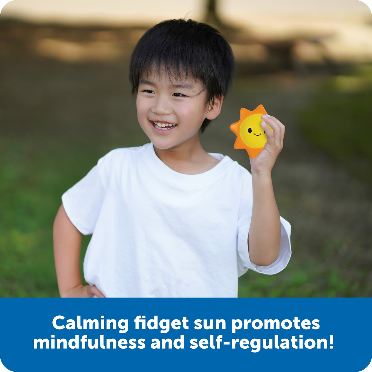 Child holding a sun-shaped fidget toy outdoors with text about its benefits.