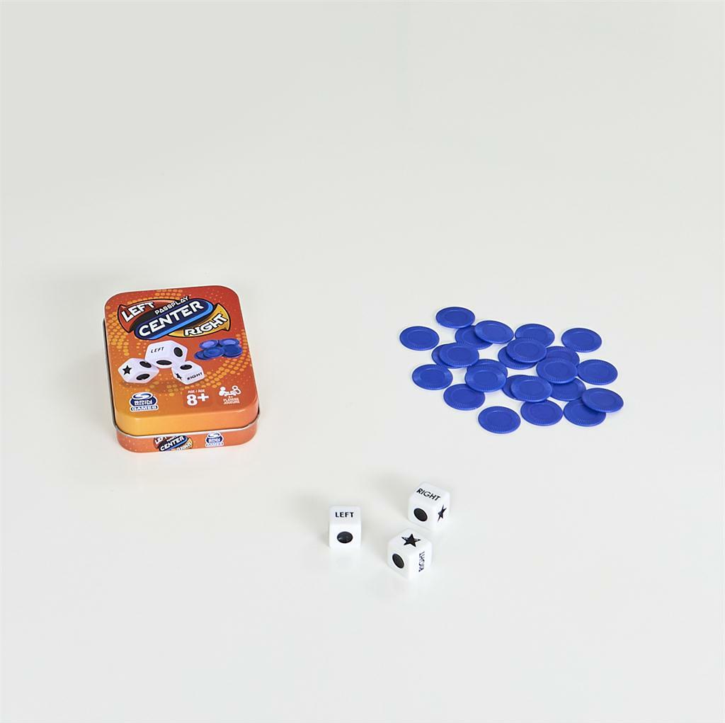 Game components including a tin labeled 'Left Center Right' with blue tokens and dice on a white background.
