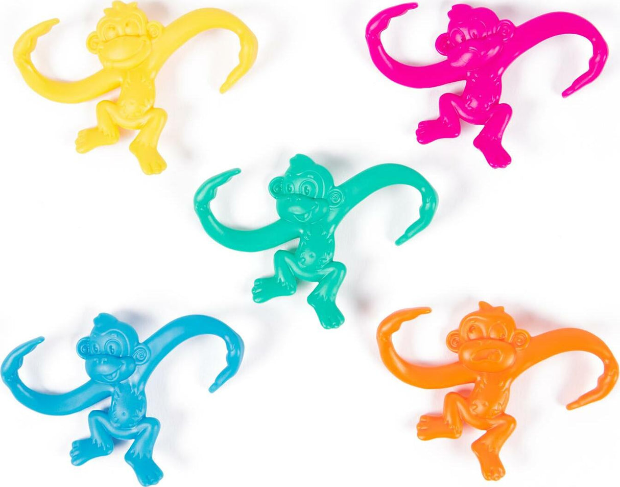 Set of colorful Barrel of Monkeys game pieces on a white background