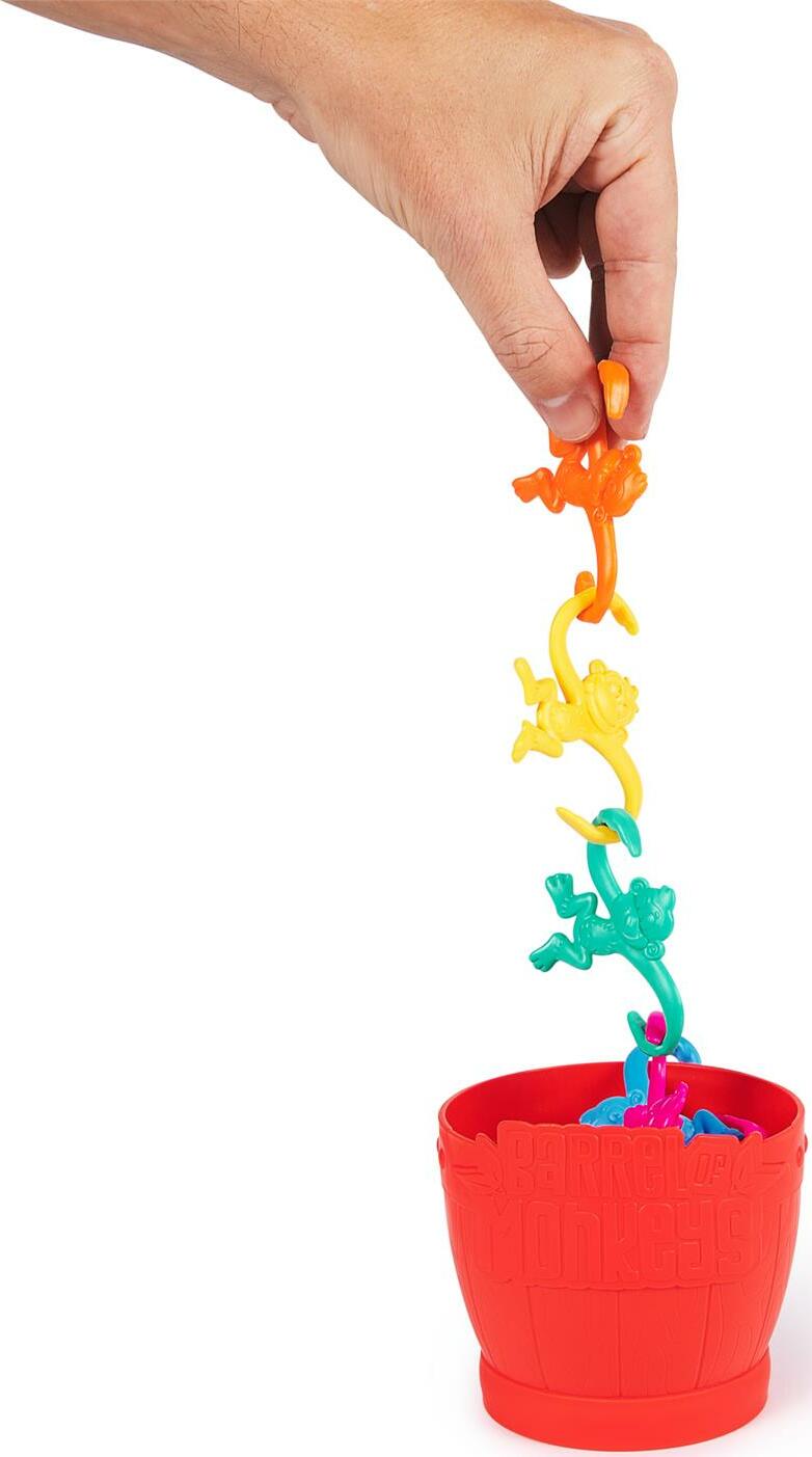 Colorful Barrel of Monkeys game pieces with a hand pulling on one of its parts, set against a white background.