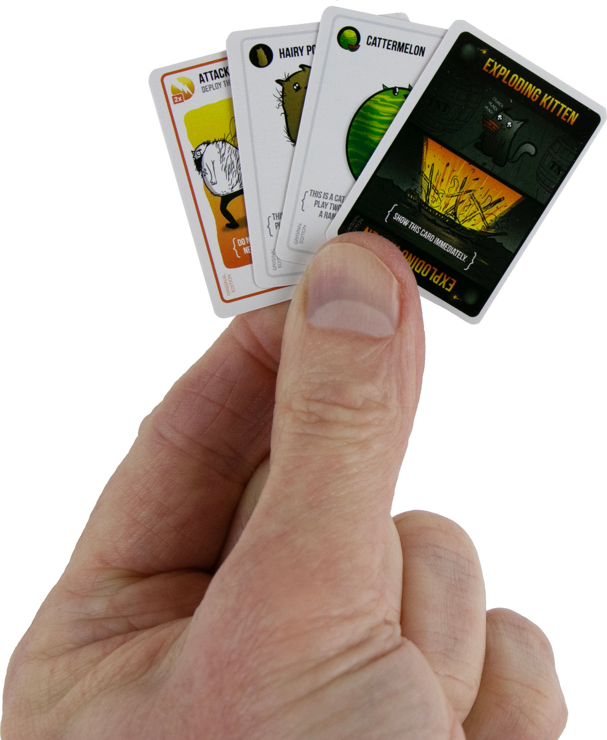 Hand holding a set of World's Smallest Exploding Kittens cards with humorous designs on a white background