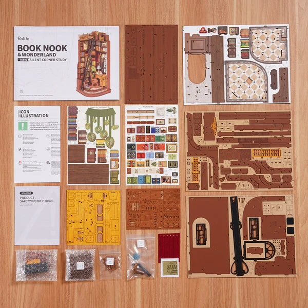 Model Silent Corner Study kit components on a wooden surface with instructions and parts.