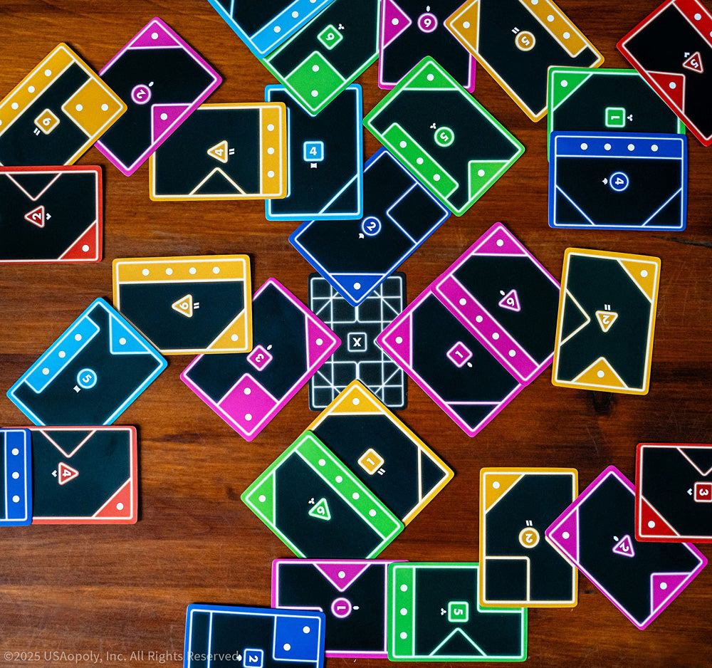 Tacta Card Game with colorful geometric cards on a wooden surface