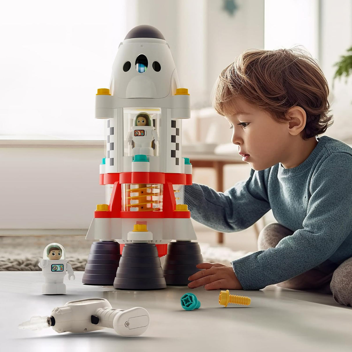 Child playing with a Space Adventure Take Apart Rocket Ship on a table
