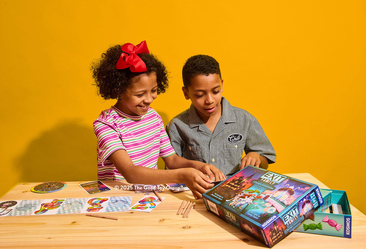 Two children playing Exit: The Game - Family Edition - 2 Escape Adventures on a yellow background