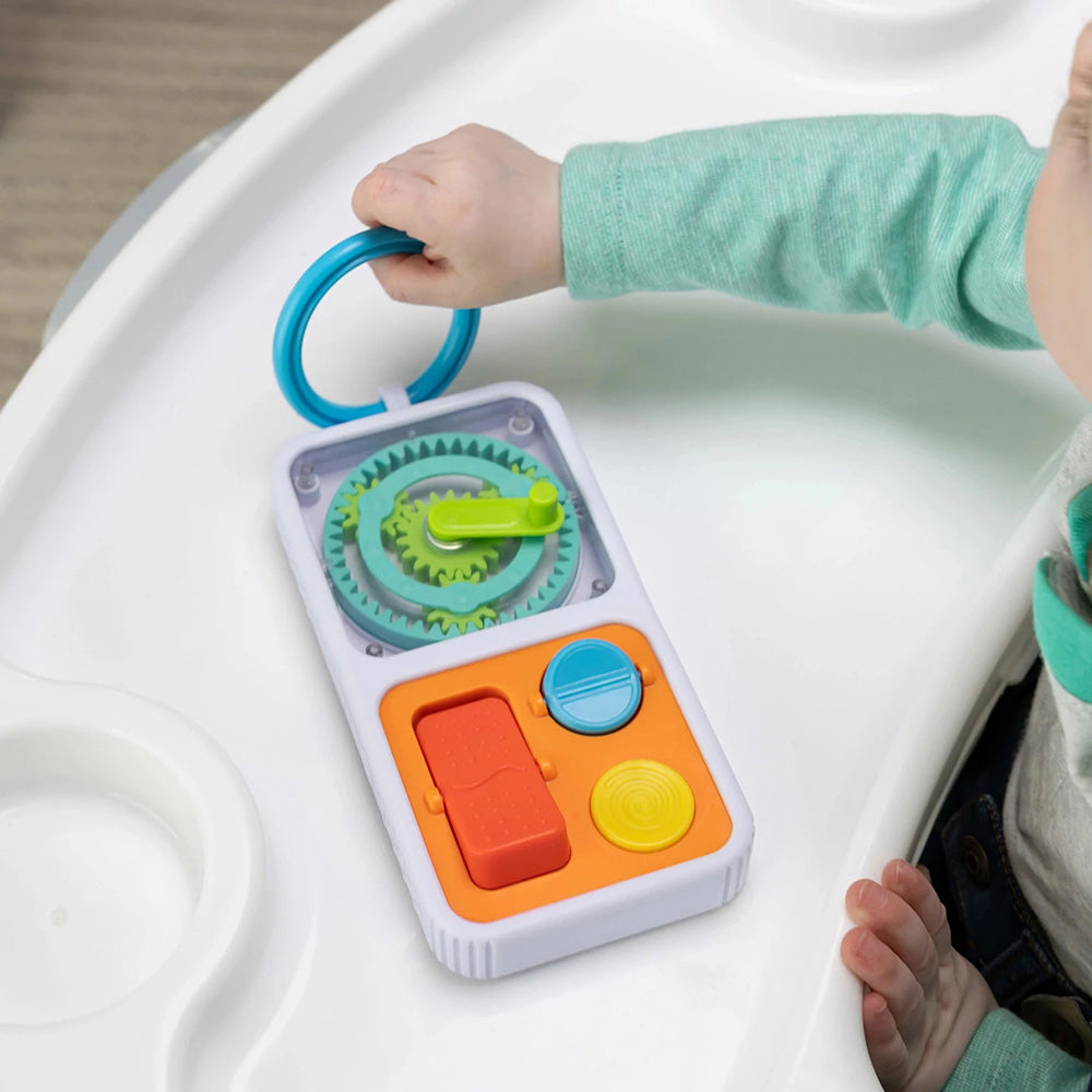 Child playing with a colorful PlayTab Go on a white surface