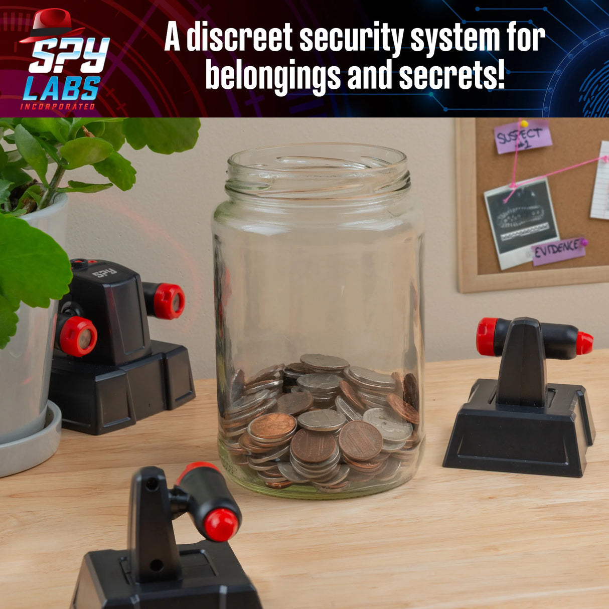 Glass jar with coins on a desk with Spy Labs: Invisible Tripwire Alarm around jar, branded 'Spy Labs'.
