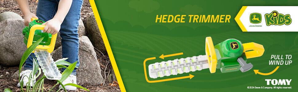 Toy hedge trimmer with John Deere branding on a green background