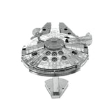 Metal model of the Millennium Falcon spaceship on a white background