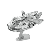 Metal model of the Millennium Falcon spaceship on a white background