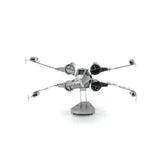 Metal model of a X-Wing Star Fighter spacecraft on a white background