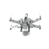 Metal model of a X-Wing Star Fighter spaceship on a white background
