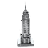 Metal model of the Empire State Building skyscraper on a white background