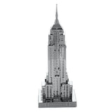 Metal model of the Empire State Building skyscraper on a white background
