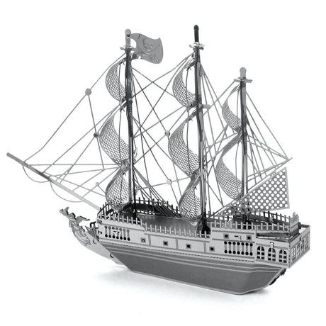 Metal model  of the Black Pearl ship with multiple masts and sails on a white background