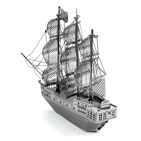 Metal model  of the Black Pearl ship of a three-masted sailing ship on a white background