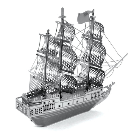 Metal model  of the Black Pearl ship  with multiple masts on a white background