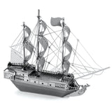 Metal model  of the Black Pearl a three-masted sailing ship on a white background