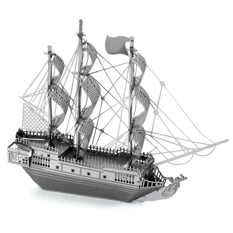 Metal model  of the Black Pearl a three-masted sailing ship on a white background