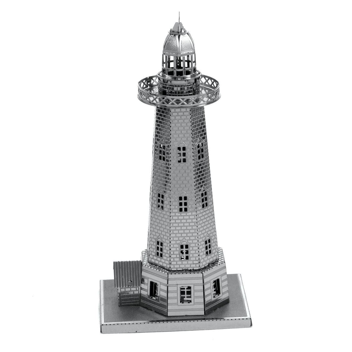 Metal model of a lighthouse on a white background