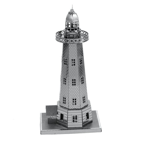 Metal model of a lighthouse on a white background