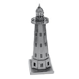 Metal model of a lighthouse on a white background