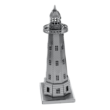 Metal model of a lighthouse on a white background