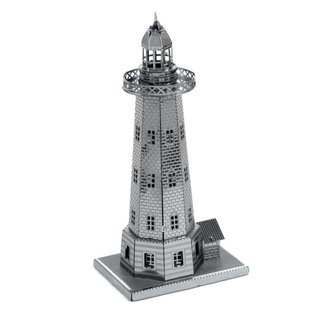 Metal model of a lighthouse on a white background