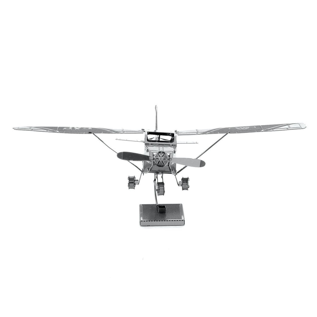 Metal model of a Cessna 172 airplane with wings on a white background