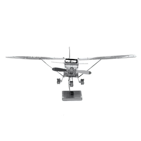 Metal model of a Cessna 172 airplane with wings on a white background