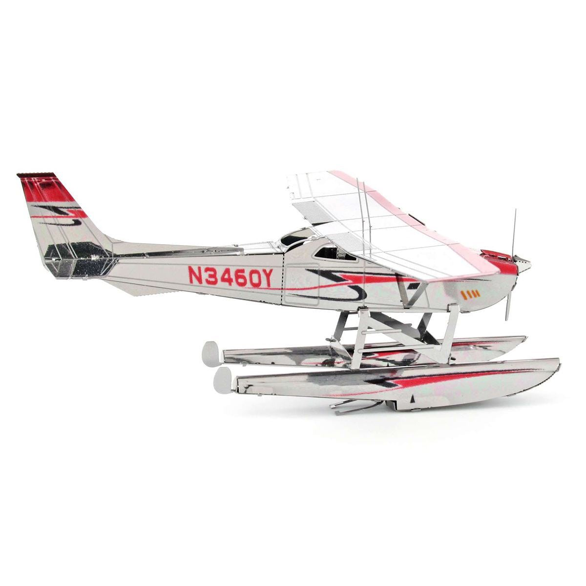 Metal model of a Cessna 182 Floatplane  with a white body, red accents, and visible registration number N346QY on a white background.