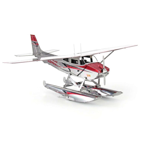 Metal model of a Cessna 182 Floatplane  with a red and silver design on a white background