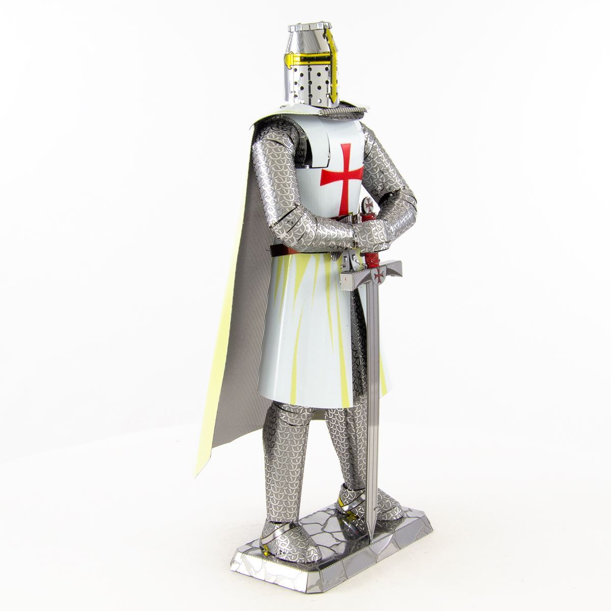 Model of a metal Templar Knight in full armor with a white tunic and red cross, standing on a white background.