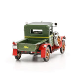 Metal model of a 1931 Ford Model A truck that is  green and red on a white background