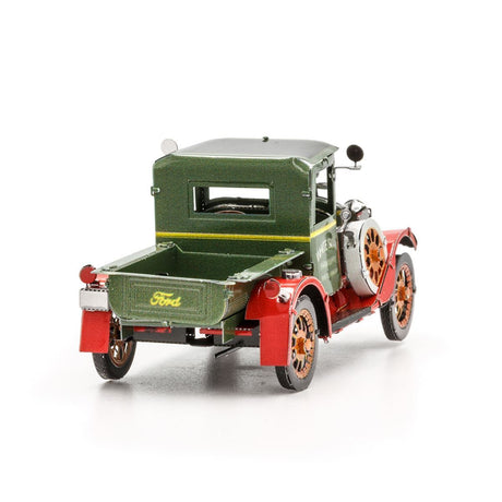 Metal model of a 1931 Ford Model A truck that is  green and red on a white background