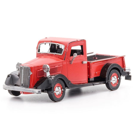 Metal model of a 1937 Ford Pickup  truck on a white background