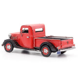 Metal model of a 1937 Ford Pickup  truck on a white background