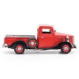 Metal model of a 1937 Ford Pickup  truck on a white background