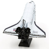 Metal model of Space Shuttle Discovery with 'NASA Discovery' on a white background