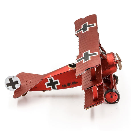 Metal model of a red Fokker Dr.I Triplane  with black crosses on a white background