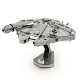 Metal model of the Millennium Falcon on a white background