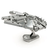 Metal model of the Millennium Falcon on a white background