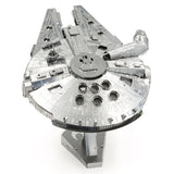 Metal model of the Millennium Falcon spaceship on a white background