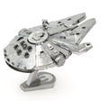 Metal model of the Millennium Falcon spaceship on a white background