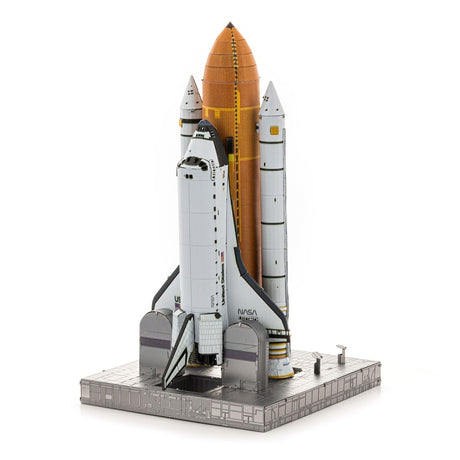 Metal model of Space Shuttle Launch Kit with orange fuel tank on a white background