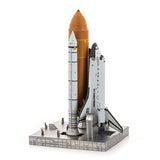 Metal model of Space Shuttle Launch Kit and rocket on a white background