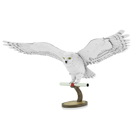 Metal model of Hedwig the owl on a white background