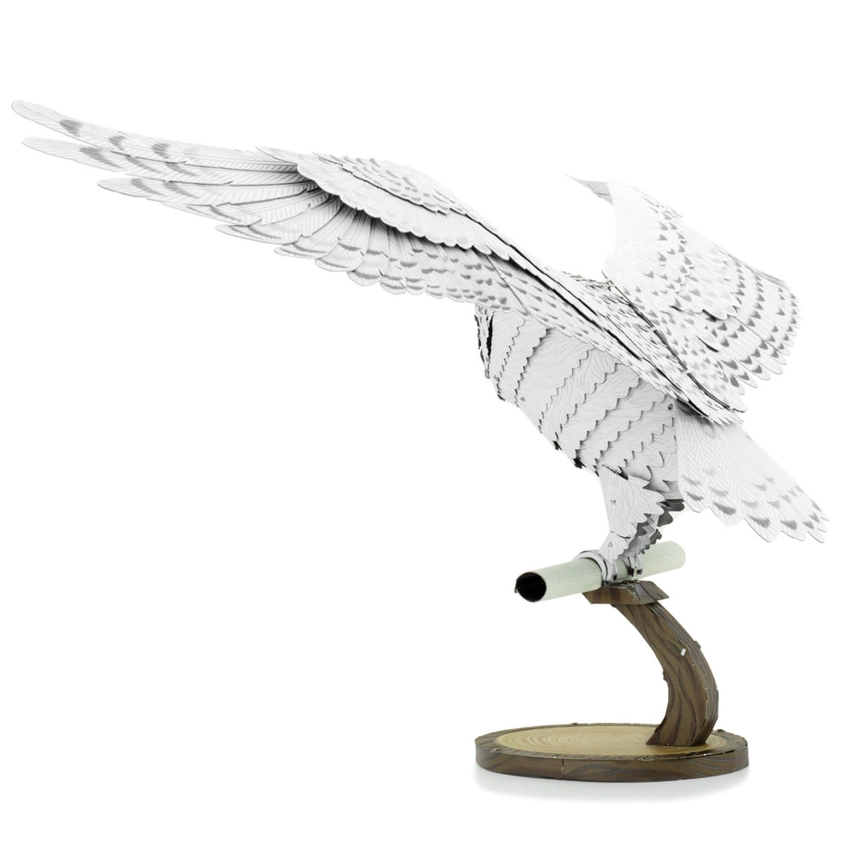 Metal model of Hedwig the owl on a white background