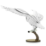 Metal model of Hedwig the owl on a white background