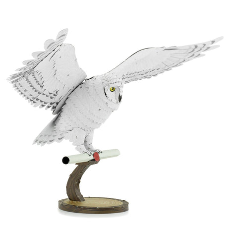 Metal model of Hedwig the owl on a white background